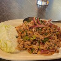 Thai Salad (Larb) · Salad of minced chicken, pork, or beef, roasted rice, dried chili flakes, and fresh herbs.