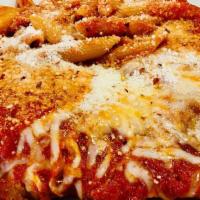 Pollo Parmigiana · Breaded fried chicken breast, tomato sauce and mozzarella, served with pasta.