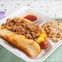 #2 Kalua Dog · Grilled 100% all-beef 1/4 lb hot dog topped with slow-roasted kalua pork, fresh-cut pineappl...