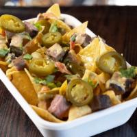 Nachos · Fresh fried chips smothered in liquid gold, need I say more?