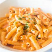 Penne Vodka · Penne pasta in a creamy tomato sauce spiked with vodka.
