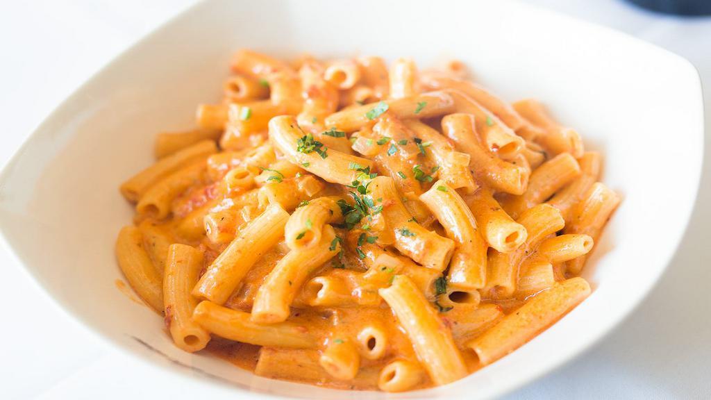 Penne Vodka · Penne pasta in a creamy tomato sauce spiked with vodka.