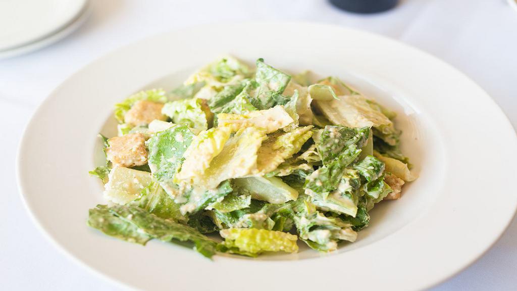 Caesar Salad · Scratch caesar romaine seasoned croutons and parmesan.