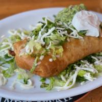 Chimichanga · Fried burrito with your choice of meat, rice, beans, lettuce, cheese, guacamole and sour cre...