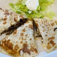 Carne Asada · Flour or corn tortillas, carne asada, cheese, lettuce and sour cream on the side.