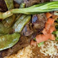 Carne Asada Plate · Grilled steak with green salad, slice of cactus, a side of rice, beans and tortillas of your...