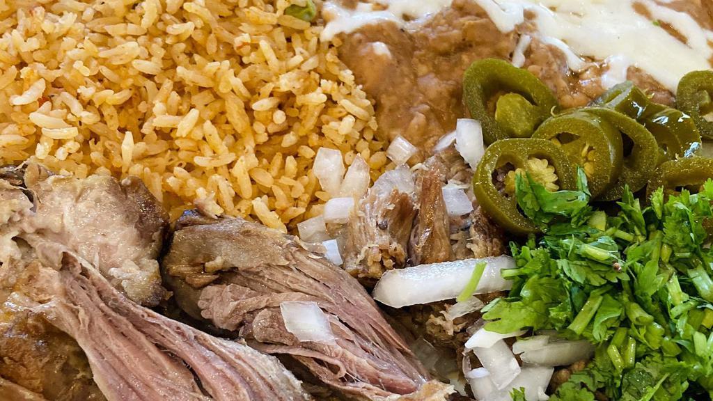 Carnitas Plate · Shredded pork with a side of rice, beans, cilantro, onions and tortillas of your choice