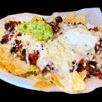 Mexiquense Nachos · Corn tortilla chips served with your choice of meat, cheese, sour cream, guacamole, and beans.