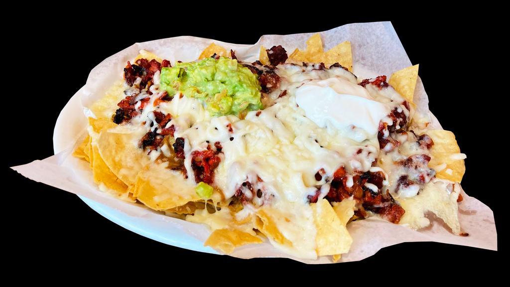 Mexiquense Nachos · Corn tortilla chips served with your choice of meat, cheese, sour cream, guacamole, and beans.
