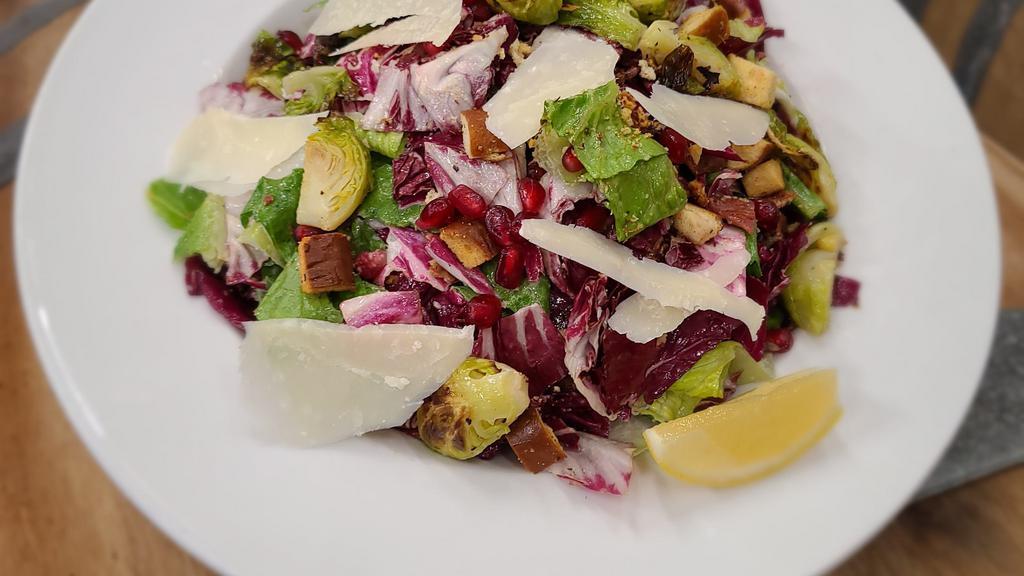 Winter Caesar · Romaine, Radicchio, Roasted Brussel Sprouts, Croutons, Bacon, Shaved Parmesan and Caesar Dressing*