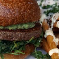 Impossible Burger (V) · Tomato Jam, Avocado, and Dressed Arugula with Vegan Garlic Mayo on a Rustic Bun. Served with...