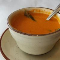 Madras Tomato Soup · Tomato, curry leaves, mustard seeds with a touch of coconut milk.