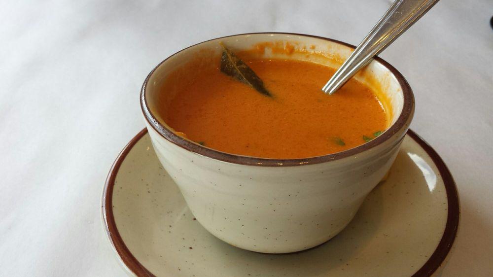 Madras Tomato Soup · Tomato, curry leaves, mustard seeds with a touch of coconut milk.