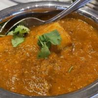 Lamb Vindaloo · Lamb cooked with potatoes in a traditional goan sauce with fiery red chili paste and a sligh...