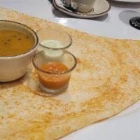 Cheese Dosa · A crepe made with fermented rice and lentil batter, garnished with shredded Cheddar and Jack...