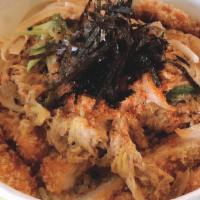 Katsudon · Breaded deep-fried meat, egg, onions cooked in sweet-savory broth over rice.