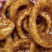 Onion Rings · One half pound of thick cut panko coated fried onion rings served with a side of our homemad...