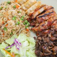T-22. Triple Combination · Chicken, beef, and three pieces gyoza with salad and fried rice.