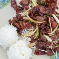 C-1. Mongolian Beef Or Chicken · Sliced tender beef or chicken with green onion garnished with rice noodles.