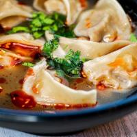 Spicy  Wonton Soup (8)  · Mild spicy. Wontons stuffed with pork in beef broth with chopped green onions.