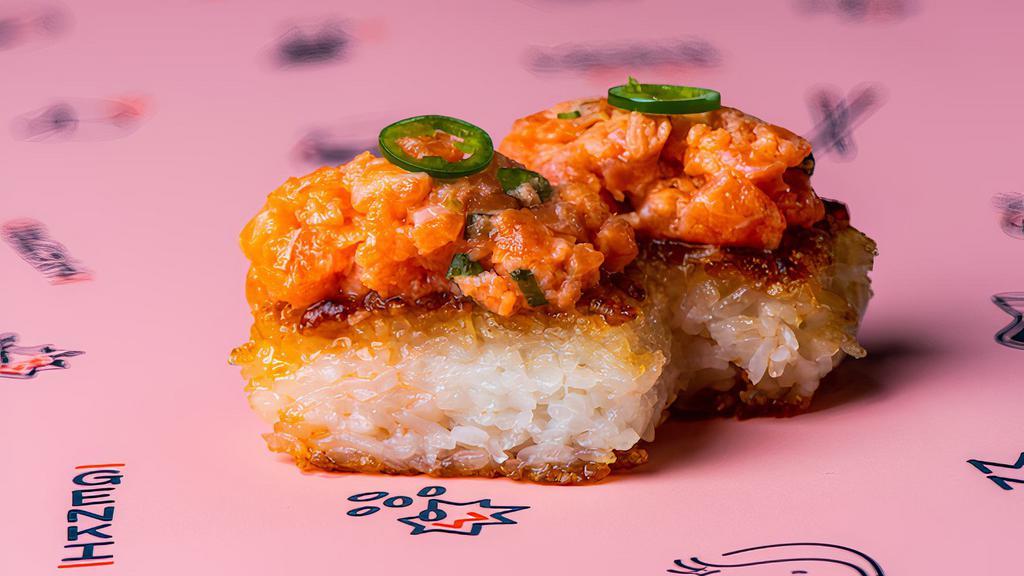 King Salmon And Yuzu Krispy Rice · grilled sushi rice, salmon yuzu mix garnished with serrano. 2 pieces
