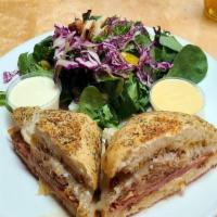 The Cubano · Served with Solid fries. A panini-style cuban sandwich with slow-braised pork, ham, swiss ch...