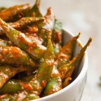 Spicy Edamame · Edamame steamed and tossed in a house-blend sauce made from ginger, garlic, soy, sesame, Kor...
