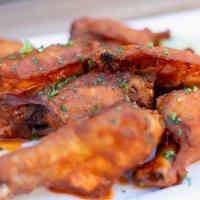 Smoked Chicken Wings · Jumbo Wings Tossed in Choice of Sauce- Buffalo, BBQ, Lemon Pepper, Sweet Thai Chili, or Fire...