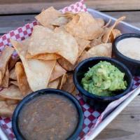 Chips & Dip · Fire Roasted Salsa + House Queso with Taco Meat + Guacamole with Cotija. Served with Fresh C...
