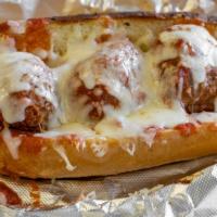 Meatball Sub · Three meatballs topped with sauce and mozzarella cheese on a toasted roll.