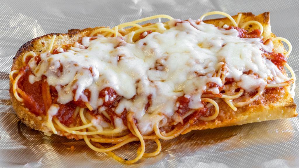 Shack Bread · A large piece of garlic bread topped with 1/8 lb of spaghetti, sauce, and smothered with mozzarella cheese. Add smashed meatballs for additional charge.