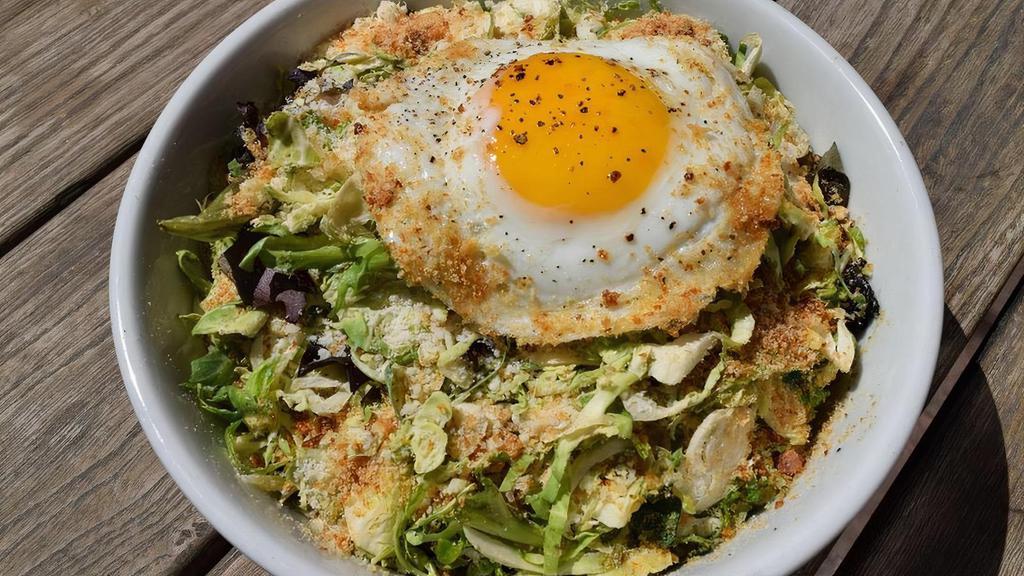 Shredded Brussels Sprouts Caesar Salad · Mixed Greens, Parmesan Croutons, Sunny Egg