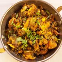 Aloo Gobi · Cauliflower and potatoes cooked with tomato, onion, herbs, and spices garnished with fresh c...