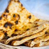 Cheese Naan · Leavened white flour bread topped with fresh home-made cheese, then baked in a tandoor.