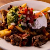 Carne Asada Fries · Hand-cut French fries topped with Grilled Angus Steak,
mixed cheese, sour cream, guacamole &...