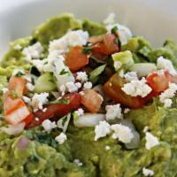 Guacamole · Fresh avocado, serranos, red onions, lime juice, cilantro. Topped with jack cheese and pico ...