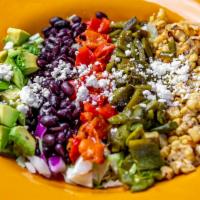 Harvest Chopped Salad · Fire-roasted poblano chile, red bell pepper, grilled corn, black beans, Mexican cheese & dic...