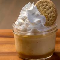 Flan · Served in a mason jar, Mexican caramel, whipped cream & Mexican cookie.
