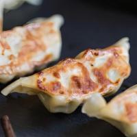 Gyoza (4 Pieces)  · 4 pieces of pan-fried pork and cabbage dumplings.