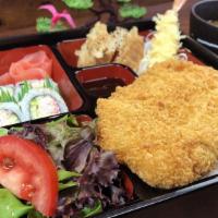 Tonkatsu Bento Box · Japanese Fried Pork Cutlet. A hearty bento set. Served with Rice, 4 pcs California Roll, 2 P...