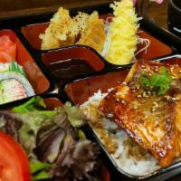 Salmon Teriyaki Bento Box · Fresh Salmon Seared to Perfection topped with our house-made Teriyaki Sauce.  Served with Ri...