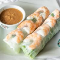 Spring Rolls · Two pieces. Green leaf lettuce, bean sprouts, cucumber, and steamed noodles all wrapped insi...