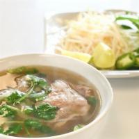 Pho · Served with your choice of meat, green onion, sliced yellow onion, and cilantro. A side of b...