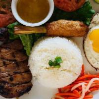 Broken Rice · Broken rice served with your choice of meat, a shrimp cake (in a lemongrass stick), carrot &...