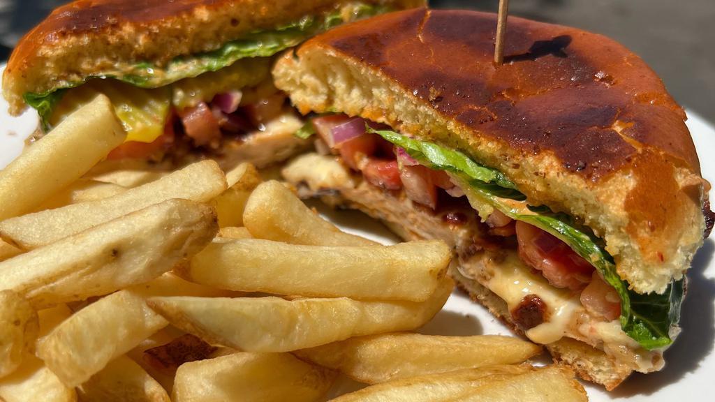 Chipotle Chicken Club · Grilled chicken served on a chipotle aioli grilled brioche bun piled high with bacon, lettuce, tomato, red onions and pickles. Served with french fries.