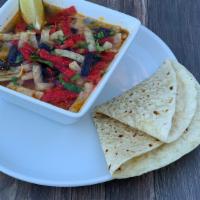 Tortilla Soup - Bowl · Corn tortilla strips with chicken, fresh green chiles, tomatoes and onions, served in a spic...