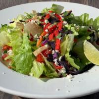 Dinner Salad · Fresh greens with tomatoes and cheese, served with your choice of dressing.