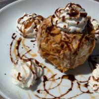 Deep-Fried Ice Cream · Cinnamon-flavored ice cream rolled in a crispy blend of cornflakes with cinnamon, then deep-...