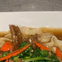 Chow Fun (Gravy) · Stir fried veggies with wide rice noodles. With choice of chicken, beef, or shrimp. Topped w...