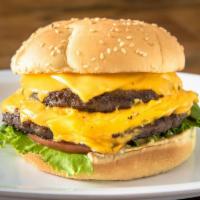 Double Cheese · Two 1/4 lb Natural Beef Patties,  2 slices of american cheese, lettuce, tomato, onion, pickl...